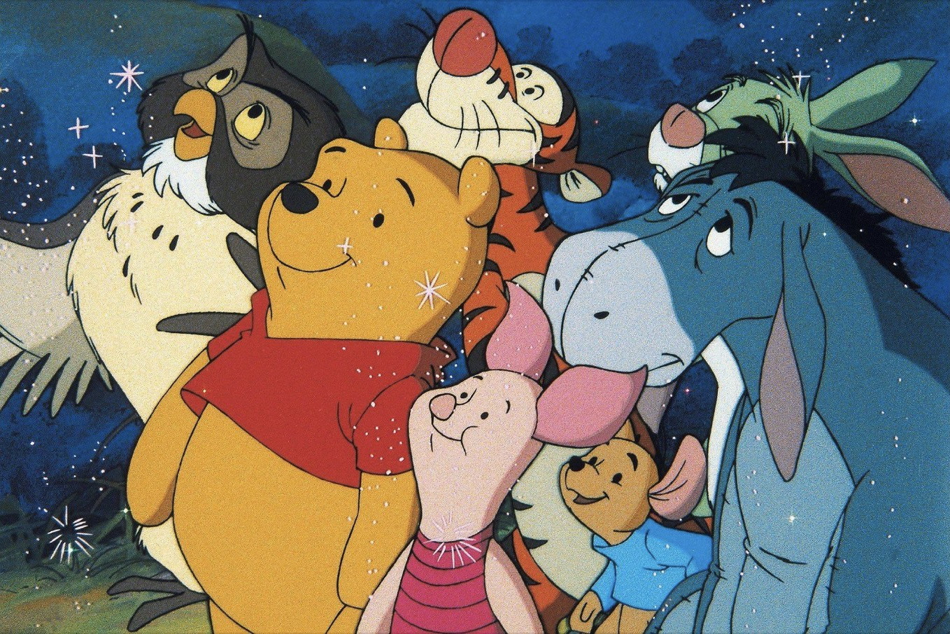 Winnie the Pooh, Piglet, Tigger, Roo, Owl, and Eeyore huddled together under a starry night sky